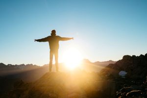 Man greeting the sunrise of a new day