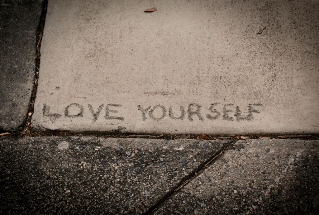Love Yourself Carved into the Pavement